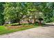 Classic brick home with black shutters, professional landscaping, and an asphalt driveway at 5130 Stoneywood Se Cir, Mableton, GA 30126