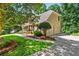 Traditional two-story home with a two car garage, landscaped yard, and a concrete driveway at 5130 Stoneywood Se Cir, Mableton, GA 30126