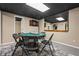Finished basement game room with a card table, dark ceiling and neutral-color walls at 5130 Stoneywood Se Cir, Mableton, GA 30126