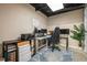 Dedicated home office features built-in storage and a large desk with a comfortable gaming chair at 5130 Stoneywood Se Cir, Mableton, GA 30126