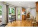 Sunlit eat-in kitchen area features hardwood floors, windows, and access to the outdoor living space at 5130 Stoneywood Se Cir, Mableton, GA 30126