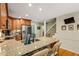 Bright kitchen boasts granite counters, stainless steel appliances, and a breakfast bar for casual dining at 5130 Stoneywood Se Cir, Mableton, GA 30126