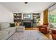 Inviting living room features a fireplace, built-in shelving, and plenty of space for entertaining at 5130 Stoneywood Se Cir, Mableton, GA 30126