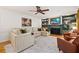 Open-concept living room offers comfortable seating, a fireplace, and lots of natural light at 5130 Stoneywood Se Cir, Mableton, GA 30126