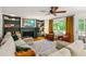 Spacious living room offers built-in bookshelves, a fireplace, and lots of natural light at 5130 Stoneywood Se Cir, Mableton, GA 30126