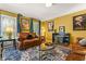 Bright living room with a patterned rug, sophisticated decor, and natural light at 5130 Stoneywood Se Cir, Mableton, GA 30126