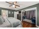 The main bedroom leads to an attached makeup vanity room and full bathroom with tub at 5130 Stoneywood Se Cir, Mableton, GA 30126