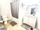A bathroom featuring a shower with curtain, toilet, and a vanity with mirror at 134 Odyssey Turn, Conyers, GA 30012
