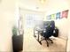 Bedroom decorated as a home office, featuring a large desk setup at 134 Odyssey Turn, Conyers, GA 30012