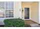 Close-up of a front door with decorative plants and a 'welcome' mat at 134 Odyssey Turn, Conyers, GA 30012