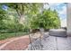 Secluded backyard with a brick patio, hot tub and wrought iron seating, perfect for relaxation at 86 Whitlock Sw Sq, Marietta, GA 30064