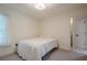 Bedroom with carpeted floor, white walls and trim, with an ensuite bathroom at 86 Whitlock Sw Sq, Marietta, GA 30064