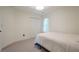 Neutral bedroom with a white bed, carpeted floor and closet with double doors at 86 Whitlock Sw Sq, Marietta, GA 30064