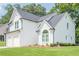 Charming two-story home with white brick and siding, attached two-car garage, and well-maintained landscaping at 86 Whitlock Sw Sq, Marietta, GA 30064