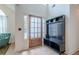 Bright foyer features hardwood floors, a storage bench and a door with sidelights at 86 Whitlock Sw Sq, Marietta, GA 30064