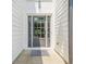 Close-up of a modern front door with glass panels and welcome mat at 86 Whitlock Sw Sq, Marietta, GA 30064