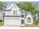 Charming two-story home with white brick and siding, attached two-car garage, and well-maintained landscaping at 86 Whitlock Sw Sq, Marietta, GA 30064