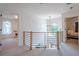 Hallway features modern railing, chandelier, and entrance to different rooms at 86 Whitlock Sw Sq, Marietta, GA 30064