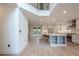 Open-concept kitchen and dining area with white cabinetry, stainless steel appliances, and hardwood floors at 86 Whitlock Sw Sq, Marietta, GA 30064
