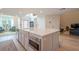 Spacious kitchen island features white countertops and stainless steel microwave at 86 Whitlock Sw Sq, Marietta, GA 30064