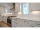 Modern kitchen features white cabinetry, marble countertops, stainless steel appliances, and ample storage at 86 Whitlock Sw Sq, Marietta, GA 30064
