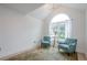 Cozy living room with vaulted ceiling, arched window, two chairs, and a decorative rug at 86 Whitlock Sw Sq, Marietta, GA 30064