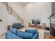Inviting living room with a modern staircase, comfortable seating, and natural light at 86 Whitlock Sw Sq, Marietta, GA 30064