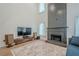 Elegant living room showcasing a fireplace, large windows and a media center at 86 Whitlock Sw Sq, Marietta, GA 30064