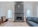 Cozy living room with a painted fireplace, windows and stylish decor at 86 Whitlock Sw Sq, Marietta, GA 30064