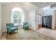 Cozy living room with vaulted ceiling, arched window, and hardwood floors at 86 Whitlock Sw Sq, Marietta, GA 30064