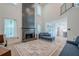 Spacious living room featuring fireplace, a staircase and an open floor plan to kitchen at 86 Whitlock Sw Sq, Marietta, GA 30064