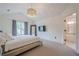 Large main bedroom with modern chandelier, vaulted ceiling, and hardwood floors at 86 Whitlock Sw Sq, Marietta, GA 30064