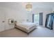 Bright main bedroom with neutral palette, large window, and modern lighting fixture at 86 Whitlock Sw Sq, Marietta, GA 30064