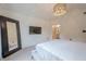 Spacious main bedroom with TV, mirror, and entry to the bathroom at 86 Whitlock Sw Sq, Marietta, GA 30064