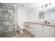Bathroom featuring a glass-enclosed shower, granite countertop, and white cabinets at 3195 Newcastle Way, Snellville, GA 30039