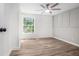 Cozy bedroom highlighting a window with natural lighting and elegant board and batten at 3195 Newcastle Way, Snellville, GA 30039
