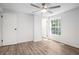 Bright bedroom featuring a ceiling fan, large window offering natural light, and neutral walls at 3195 Newcastle Way, Snellville, GA 30039