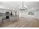 Spacious kitchen with stainless steel appliances, a central island, and stylish modern lighting at 3195 Newcastle Way, Snellville, GA 30039