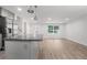 Stylish kitchen island with stainless steel appliances and wood flooring throughout at 3195 Newcastle Way, Snellville, GA 30039