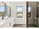 Contemporary bathroom with double vanities and glass-enclosed shower, blending style with functionality at 367 Parkway Ne Dr # 7, Atlanta, GA 30312