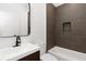 Well-appointed bathroom boasts modern tile, tub, and a sleek vanity for a refreshing experience at 367 Parkway Ne Dr # 7, Atlanta, GA 30312