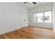 Bright bedroom with hardwood floors, a ceiling fan and a large window at 367 Parkway Ne Dr # 7, Atlanta, GA 30312
