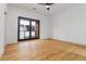 Spacious bedroom features hardwood floors, neutral walls, and sliding glass doors to a balcony at 367 Parkway Ne Dr # 7, Atlanta, GA 30312