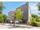 Modern building featuring a combination of metal, wood, and white finishes with mature trees at 367 Parkway Ne Dr # 7, Atlanta, GA 30312