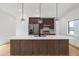 Modern kitchen featuring an island, stainless steel appliances, and sleek pendant lighting at 367 Parkway Ne Dr # 7, Atlanta, GA 30312