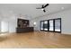 Open floor plan with modern kitchen, island, hardwood floors, and large sliding doors at 367 Parkway Ne Dr # 7, Atlanta, GA 30312