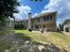 Large backyard with covered patio and outdoor seating area at 5771 Vinings Retreat Sw Way, Mableton, GA 30126