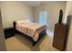 Cozy bedroom featuring a bed, nightstand, TV, and window, providing a comfortable space at 5771 Vinings Retreat Sw Way, Mableton, GA 30126