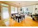 Open-concept dining area with hardwood floors, a dining table, and seamless flow to living spaces at 5771 Vinings Retreat Sw Way, Mableton, GA 30126