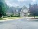 Charming community clubhouse with well-manicured landscaping and inviting entrance at 5771 Vinings Retreat Sw Way, Mableton, GA 30126